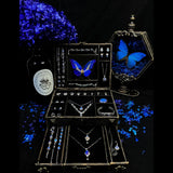 Luxury Blue Morpho butterfly jewelry box featuring a real Morpho helena butterfly display with handmade butterfly wing jewelry collection.