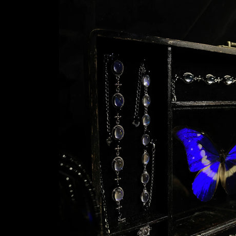 Detailed view of hidden storage drawer inside a handcrafted Blue Morpho butterfly jewelry box.