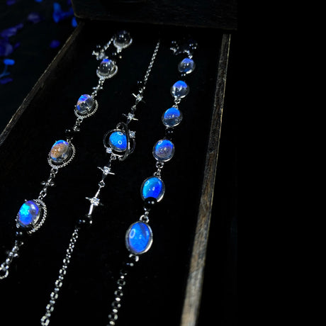 Velvet-lined necklace compartment displaying handmade Morpho helena butterfly wing pendant jewelry.